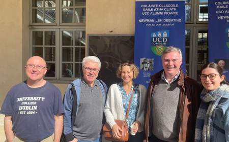 UCD alumni at Erasmus Paris Picnic 2025. The group stands in front of UCD Alumni France banners.